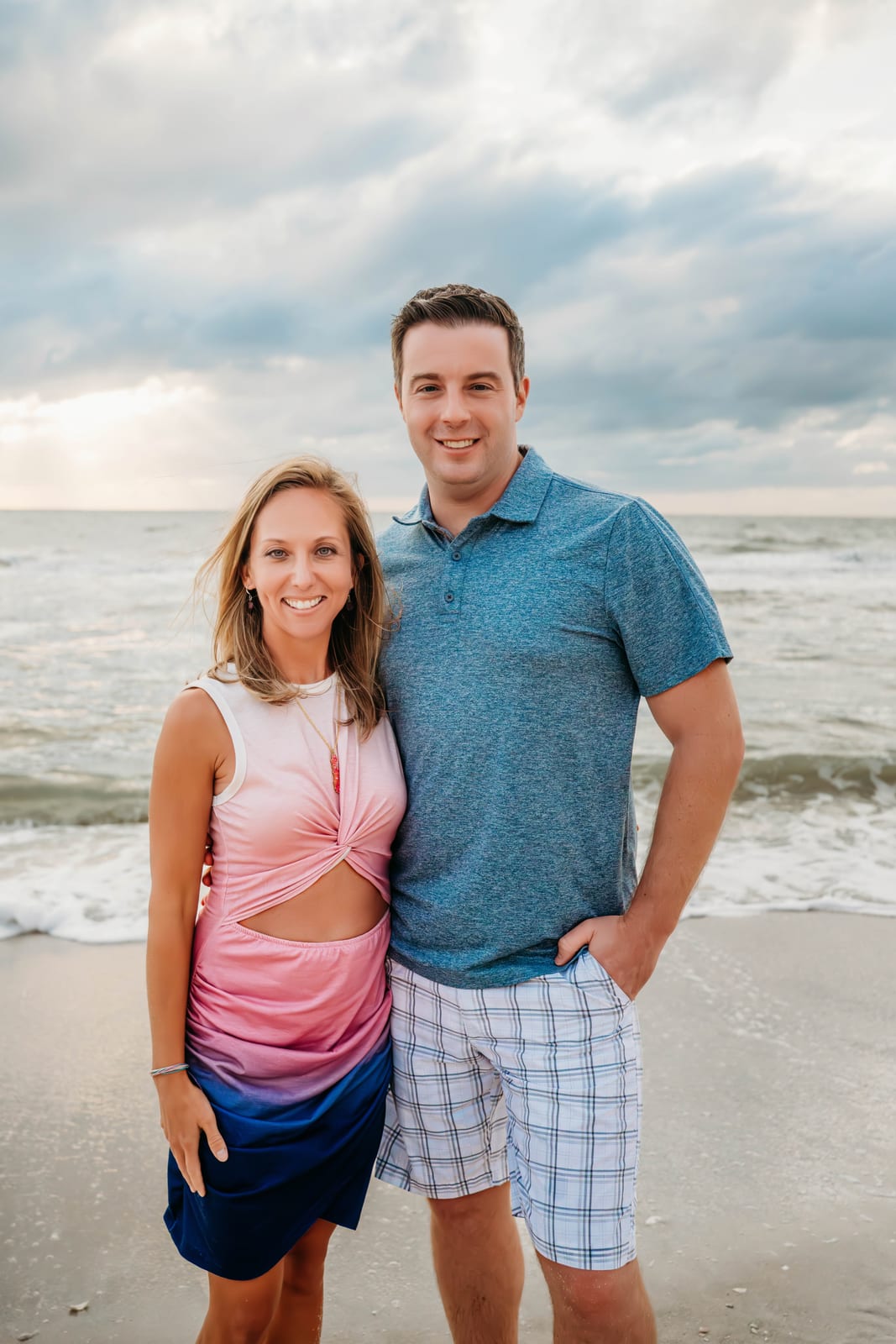 Crystal Joy and her husband together on a golden-hour beach